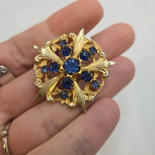 Vintage Blue Prong Set Rhinestone Gold Tone Fleur De Lis Round Brooch