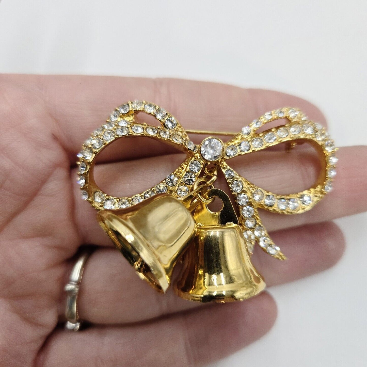 Vintage Monet Large Holiday Goldtone Clear Rhinestone Bow Bells Brooch Pin 1990s