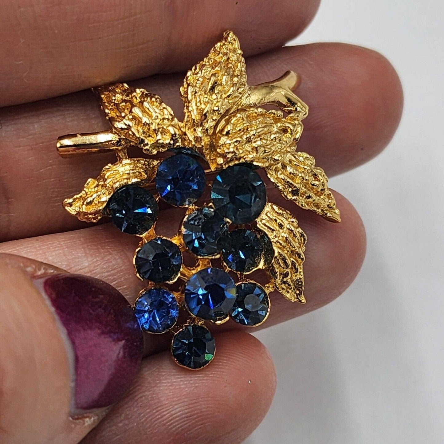 Vintage CROWN TRIFARI Blue Sapphire Rhinestone Grapes Gold Tone Brooch Signed